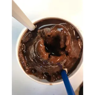 ows a bowl of chocolate pudding