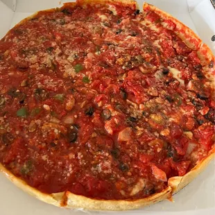 Deep Dish Cheese Pizza with green peppers, mushrooms, onions, olives, and of course butter crust.