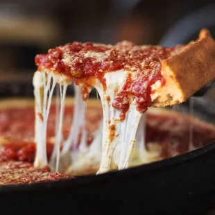 a slice of deep dish pizza