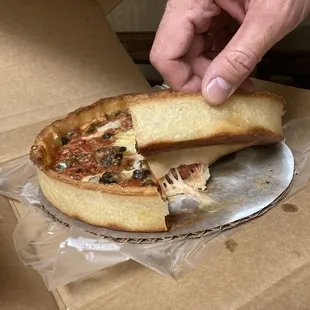 Undercooked pizza sticking to cardboard