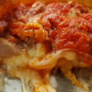 Look at all that melted cheese on the sheet sausage