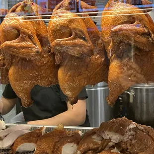 Chickens hanging ready to be eaten
