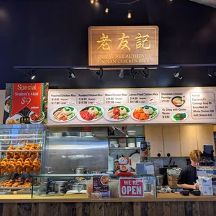a restaurant counter with a variety of food items