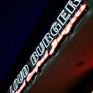 a neon sign for a fast food restaurant