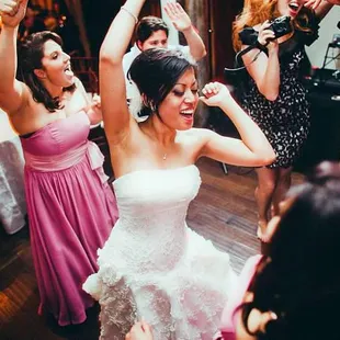 A good wedding DJ caters to the bride but also reads the crowd to see what music moves them.  This is one of our happy clients!