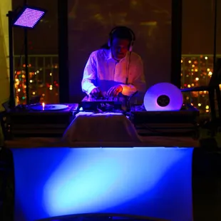 Loud DJs owner and main DJ Eric P. spinning music at a private corporate party at the top of Los Angeles City Hall.