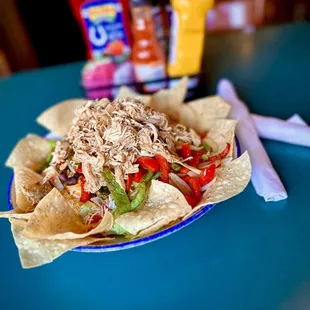 That's a salad!
Southwest Salad - grilled peppers &amp; onions, fiesta mix, tortilla's &amp; southwest chicken over crisp lettuce.