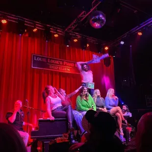 a group of people on stage