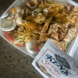 House Salad added Grilled Chicken. With my one little packet of honey mustard!