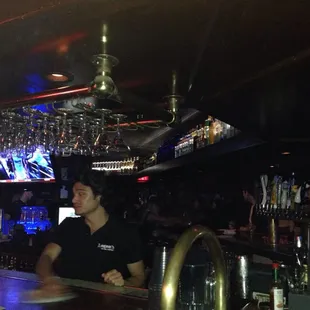 two men sitting at a bar