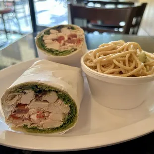 Tuscan Pita: chicken, mixed greens, tomatoes, feta cheese, bell peppers, pesto, and balsamic