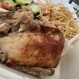1/2 chicken where spaghetti pasta and cucumber tomato salad