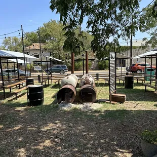 an outdoor bbq with a fire pit