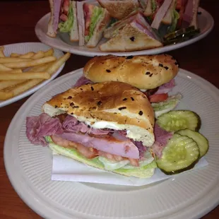 Louie&apos;s 1/2 pound &quot;Piggy Sandwich&quot;. Corned beef, delicious thick sliced ham &amp; bacon on a onion roll.