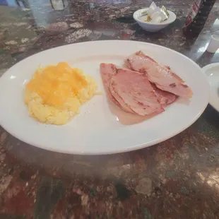 Scrambled eggs with American cheese on top