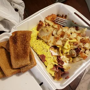 Pastrami omelet with Swiss cheese and hash Browns and wheat toast.
