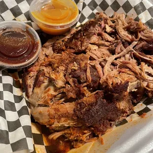 1lb pulled pork $16 came with brown and yellow bbq sauce. Rub was sweet.