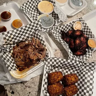1lb pulled pork, 12 wings, large corn, large Mac and cheese, large green bean
