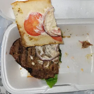 a sandwich in a styrofoam container