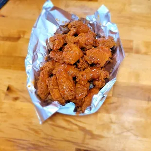 chicken wings wrapped in foil