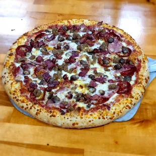 a pizza on a wooden table