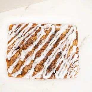a cinnamon roll with icing