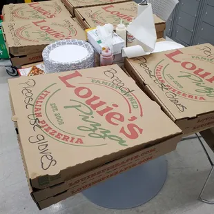 Twelve boxes of Louie&apos;s Assorted Pizzas and 2 Chessy Bread delivered to work, &quot;Employee Appreciation &amp; New Year Lunch/Dinner!&quot; 1/3/2025