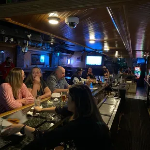 people sitting at the bar