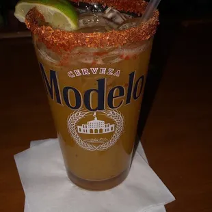 a bloody drink with a lime wedge