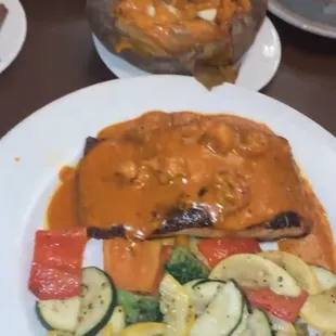 Cajun Salmon, seasonal vegetables and sweet potato. Ribeye Steak in the back