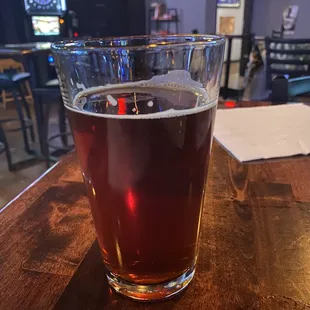 a glass of beer on a table