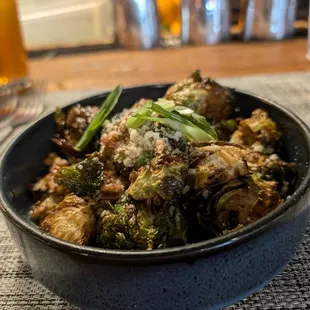 CRISPY PECAN BRUSSELS SPROUTS candied pecans, sweet serrano sauce, shaved green onion, sprinkled parmesan