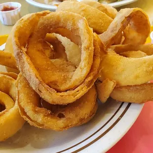 Pretty looking but  tasteless $7 onion rings .... Never again   and had the nerve to charge 95 cent for suace