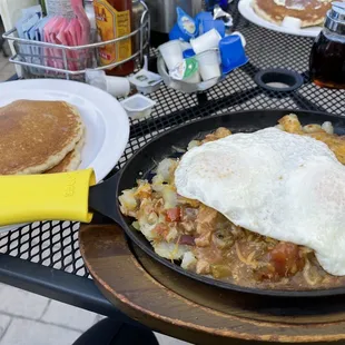 Veggie skillet with added pork green chili with bacon and pancakes as a side - so yummy