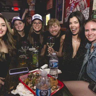 a group of women sitting at a table