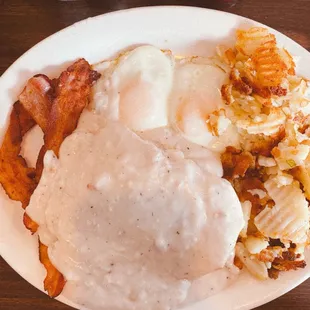 Biscuits and gravy w/ basted eggs, bacon&amp; potatoes