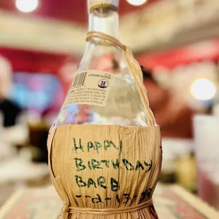 a bottle of wine with writing on it