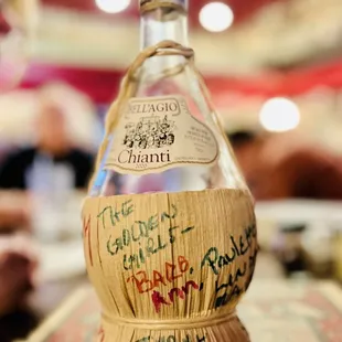 a bottle of wine with writing on it