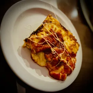 a slice of pizza on a plate