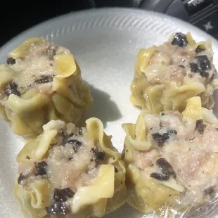 Like pork hash or shumai... taste good!  This place is called Louise's but I'm pretty sure that ain't the lady owners name.