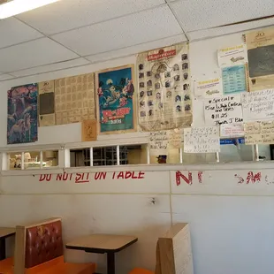 the inside of a restaurant with tables and chairs