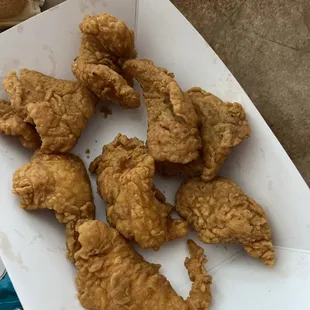 Half of a half of a fish cut into 10 pieces.