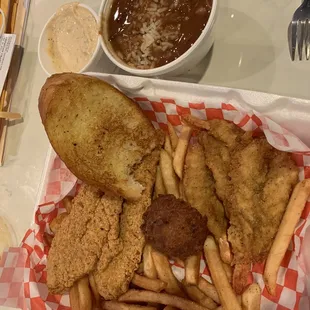 Catfish and shrimp basket with fries and toast- additional side of red beans and rice and hush puppies.