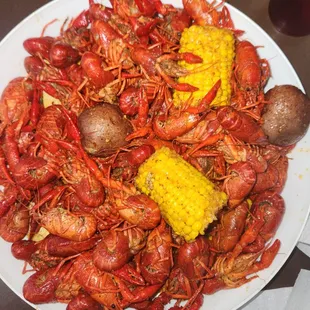 Garlic butter crawfish with corn and potatos.