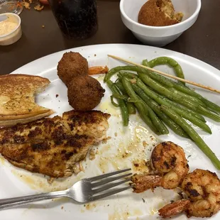 Grilled red fish, grill shrimp, green beans and THE BEST HUSHPUPPIES I&apos;VE EVER HAD!