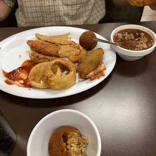 Fried catfish, fried shrimp, fried boudin ball, fried chicken tenders and onion rings.