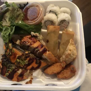 2 Fish &amp; Shrimp Combo Box 1 w. Salmon over rice, a side of salad, 2 spring rolls, 2 fried shrimp, 4 sushi rolls, &amp; 2 fried dumplings.