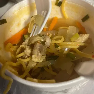 a fork in a bowl of soup
