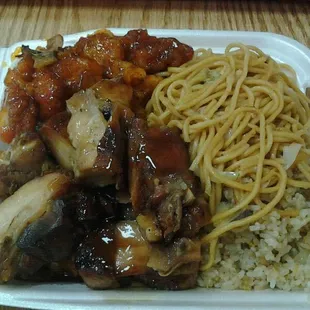 Half chow mien half rice with orange chicken and teriyaki chicken.