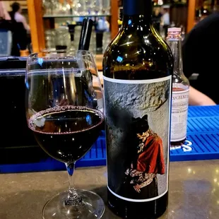 a glass of wine and a bottle of wine